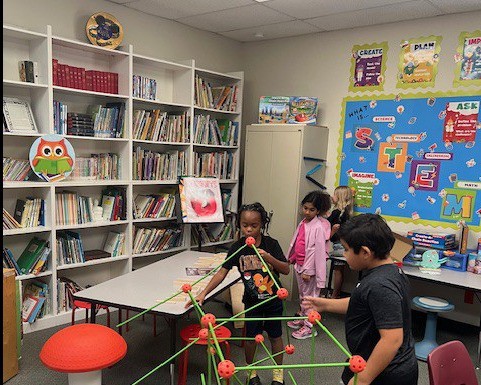 Students collaborating on a STEM challenge