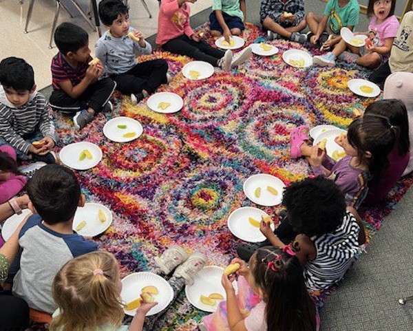 Pre-K students sampling apples