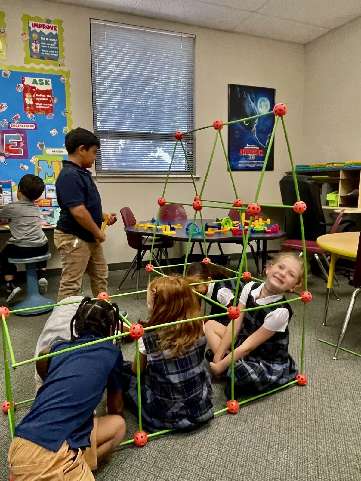 Students building structures in the classroom